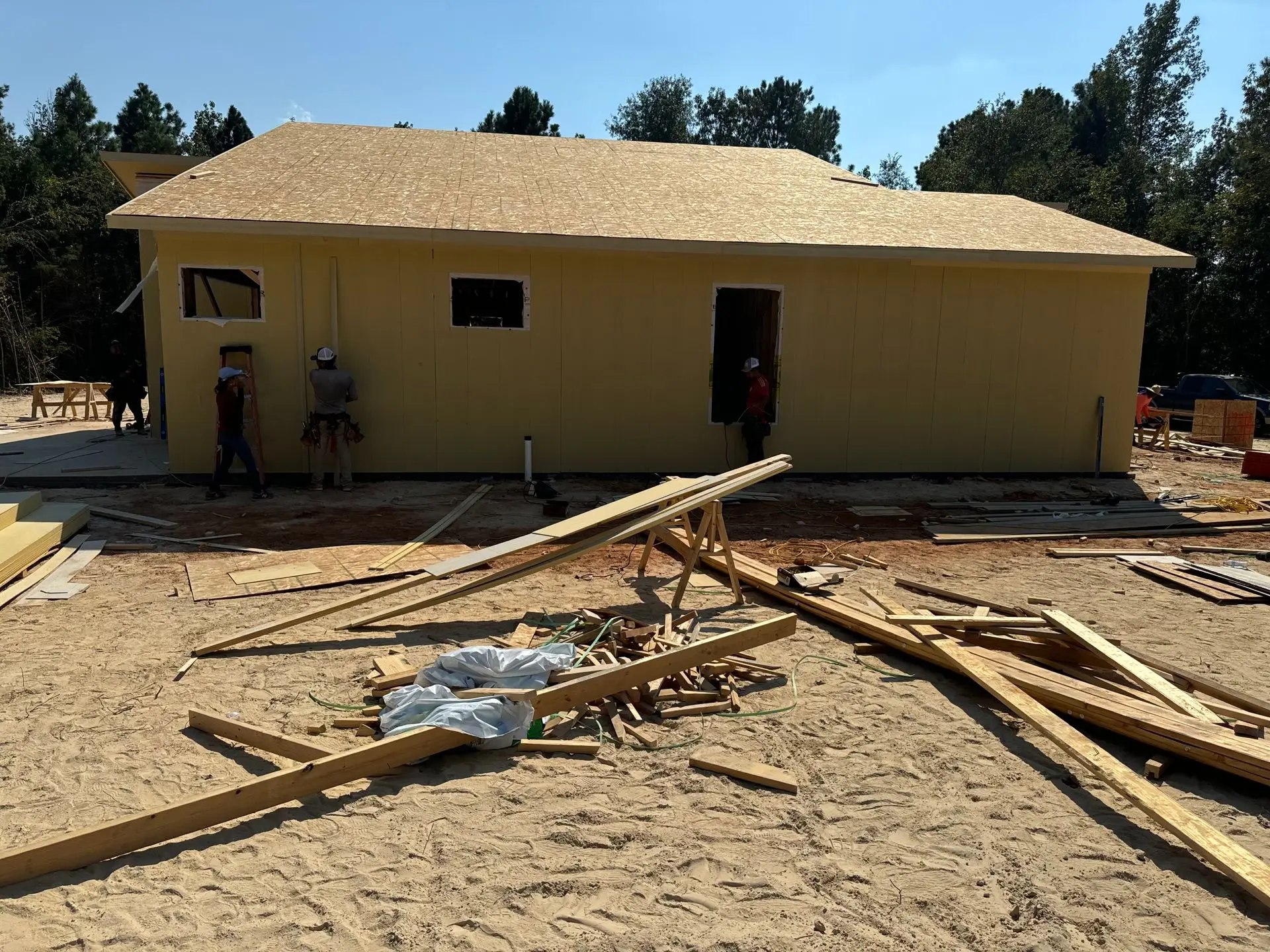 Hip roof addition decked and ready for shingles