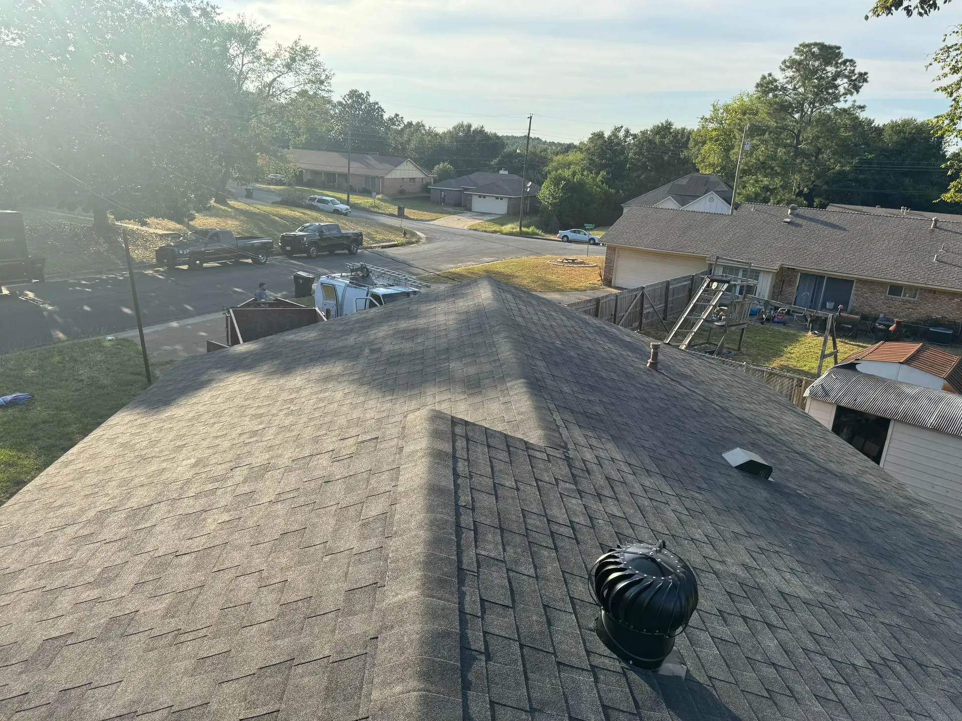 Aerial view of a finished shingle roof installation