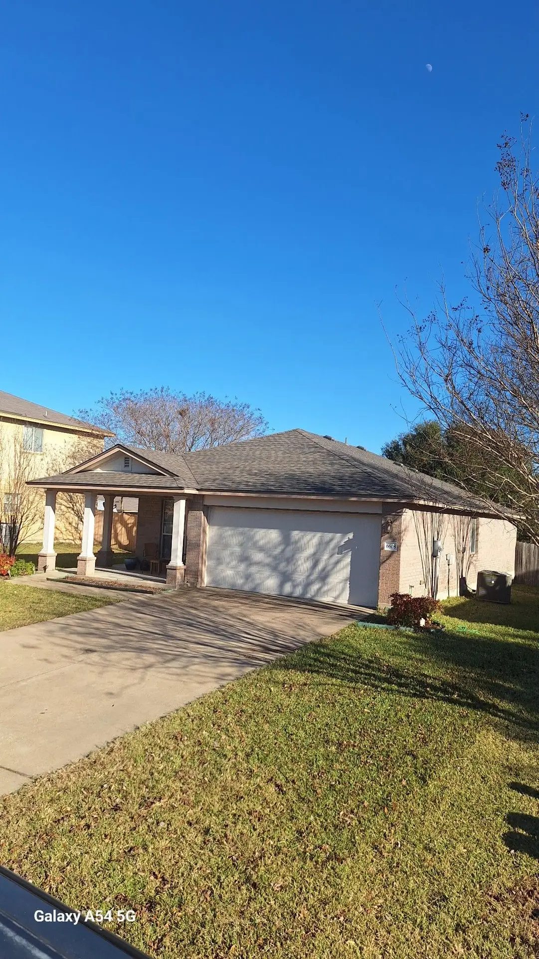 Single-story brick home with new roof in Central Texas