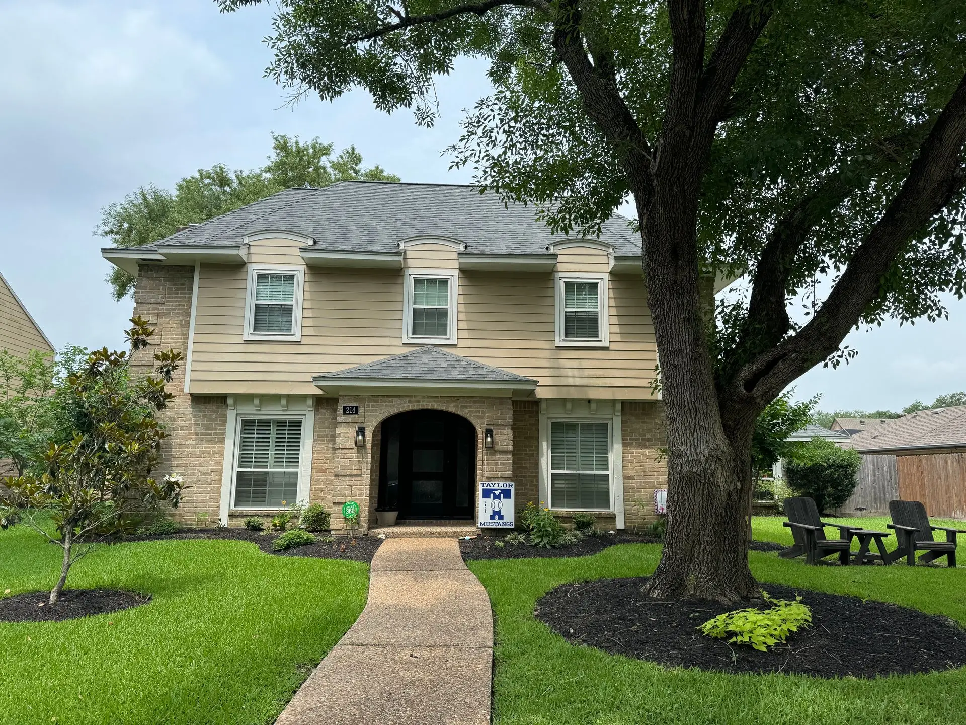 Two-story home with refreshed roof and clean exterior